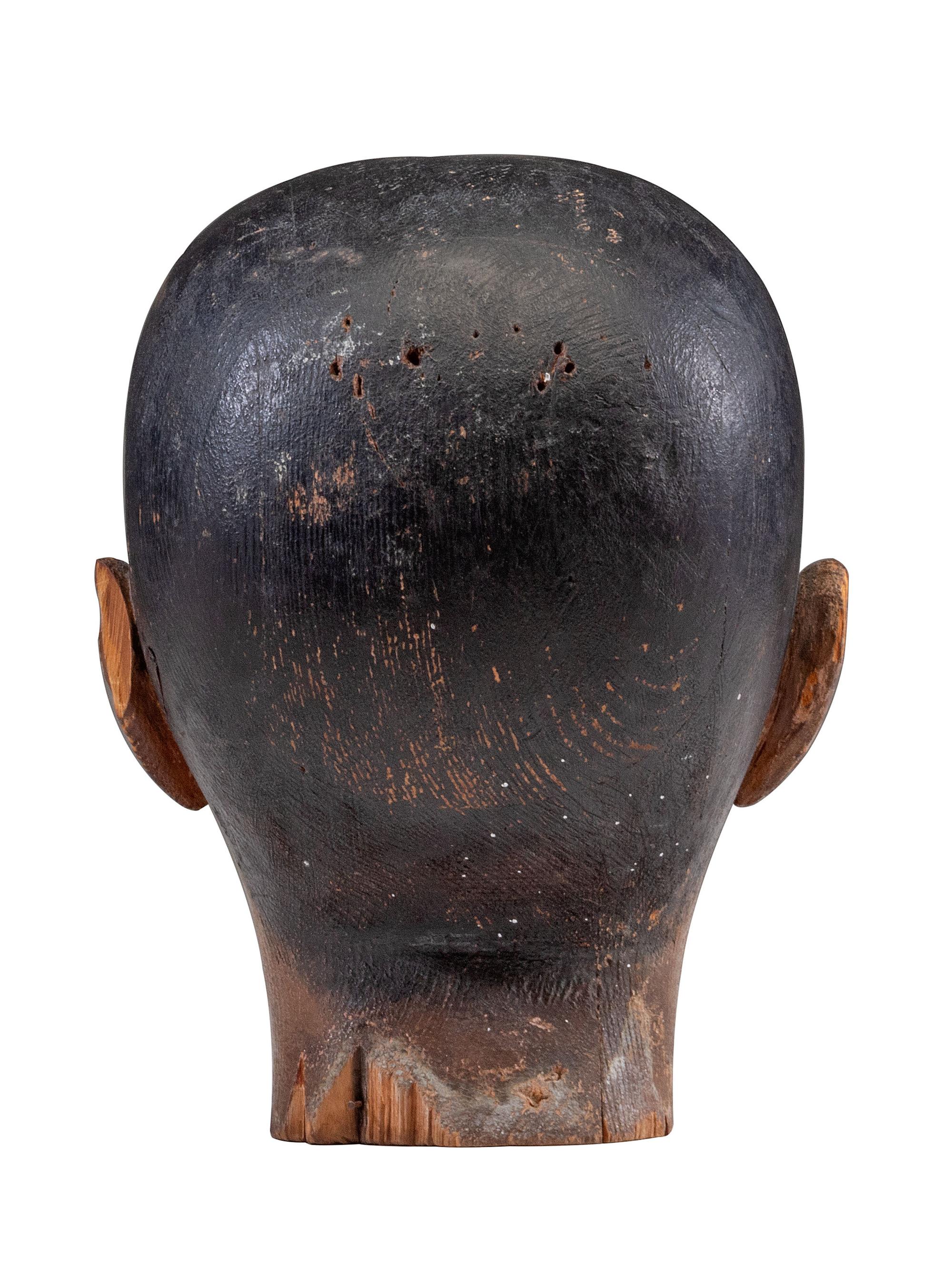 A Folk Art Carved and Painted Pine Carnival Head