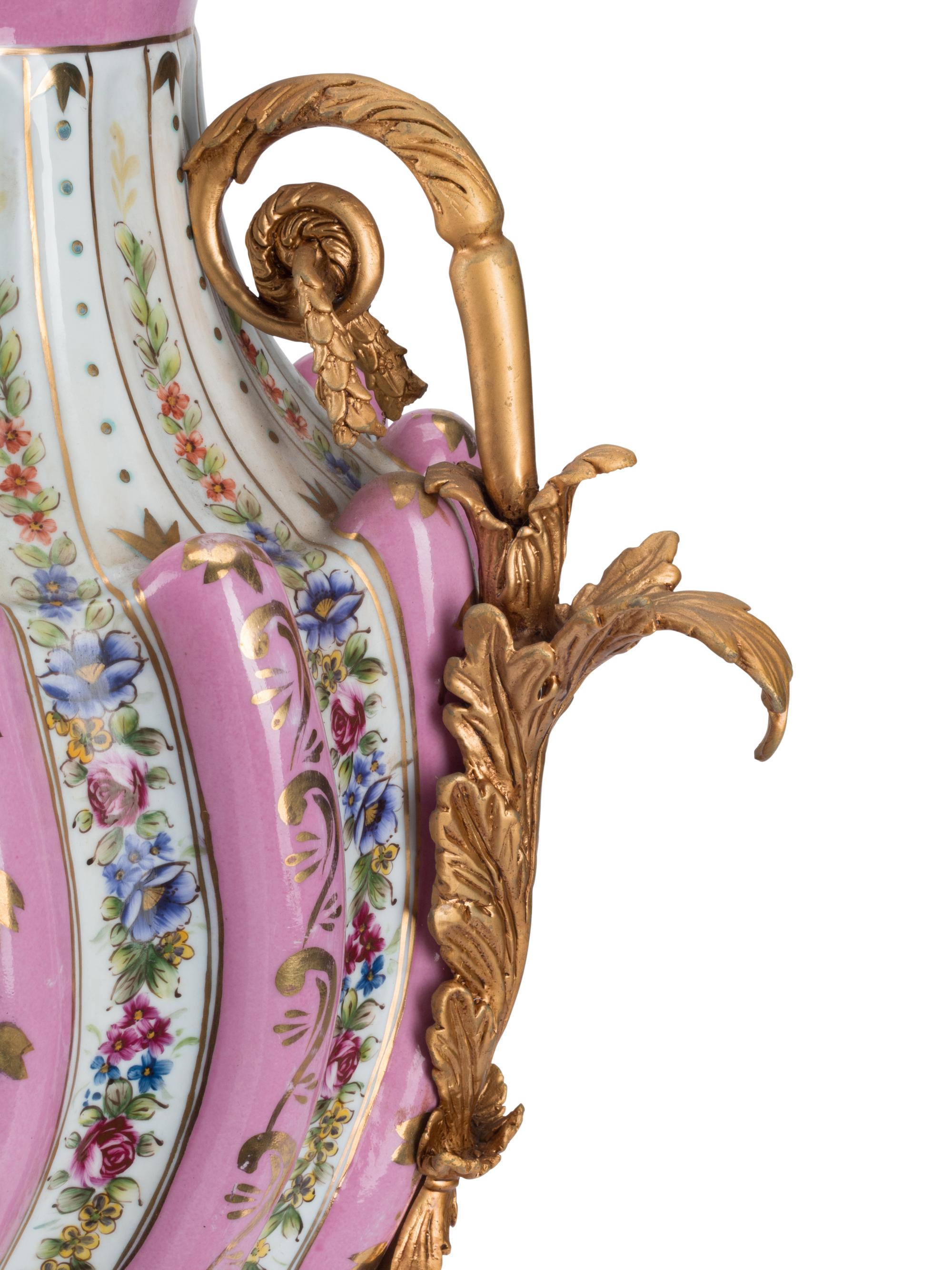 A Pair of Gilt Bronze Mounted Sèvres Style Porcelain Urns