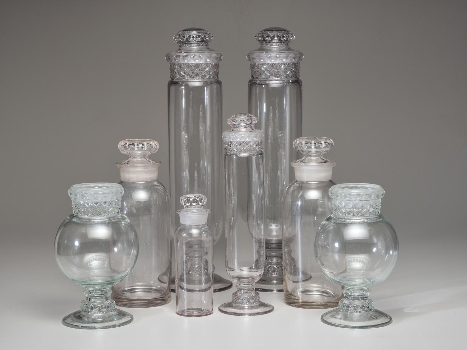 Eight Molded Glass Display Jars