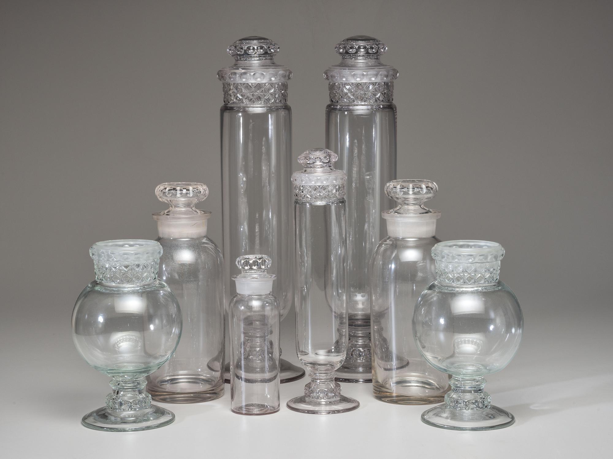 Eight Molded Glass Display Jars