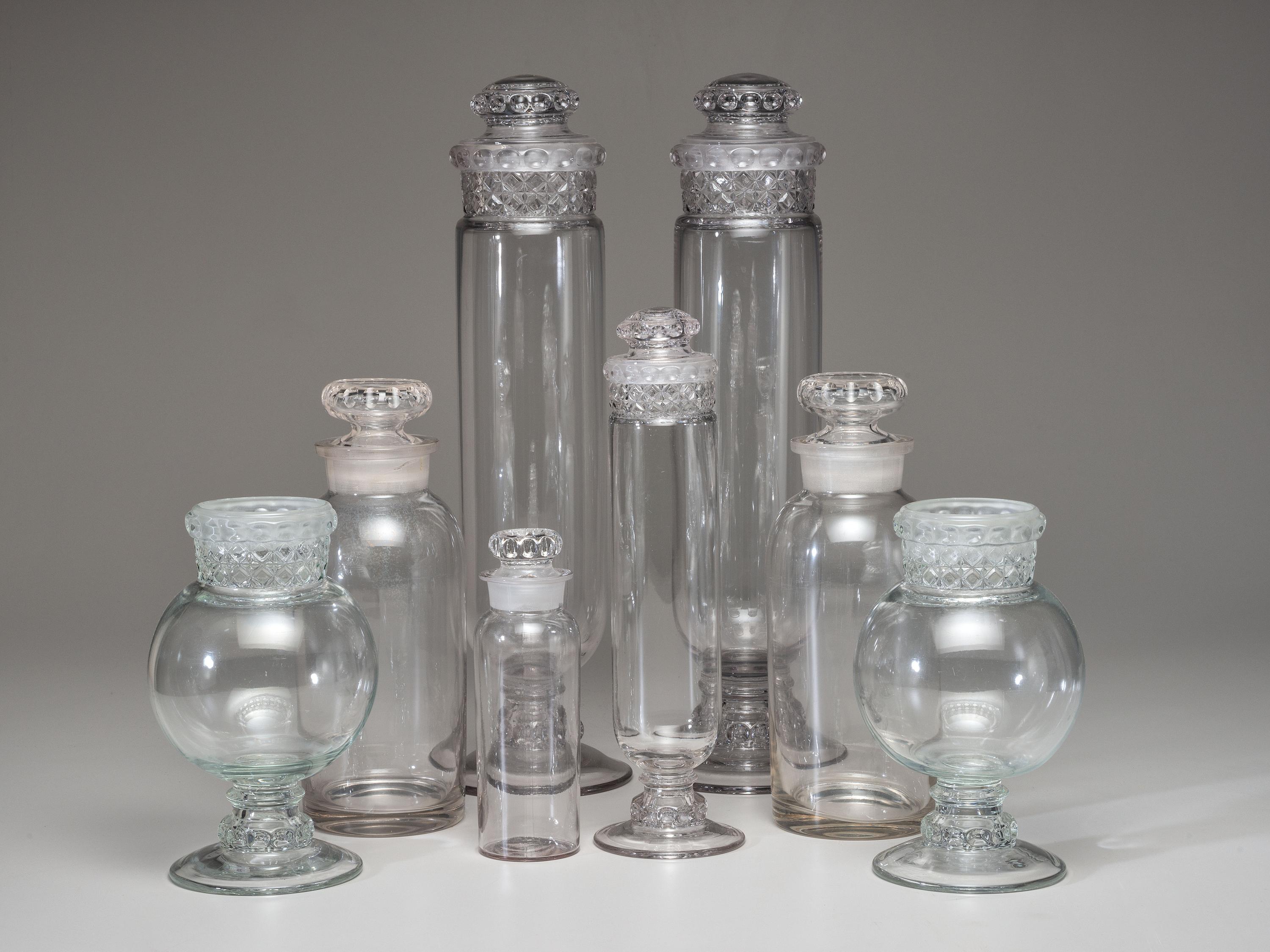 Eight Molded Glass Display Jars