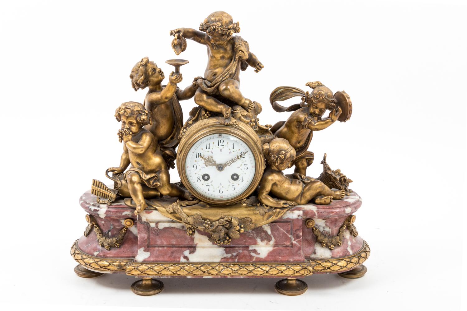 A French Gilt Bronze and Marble Mantel Clock