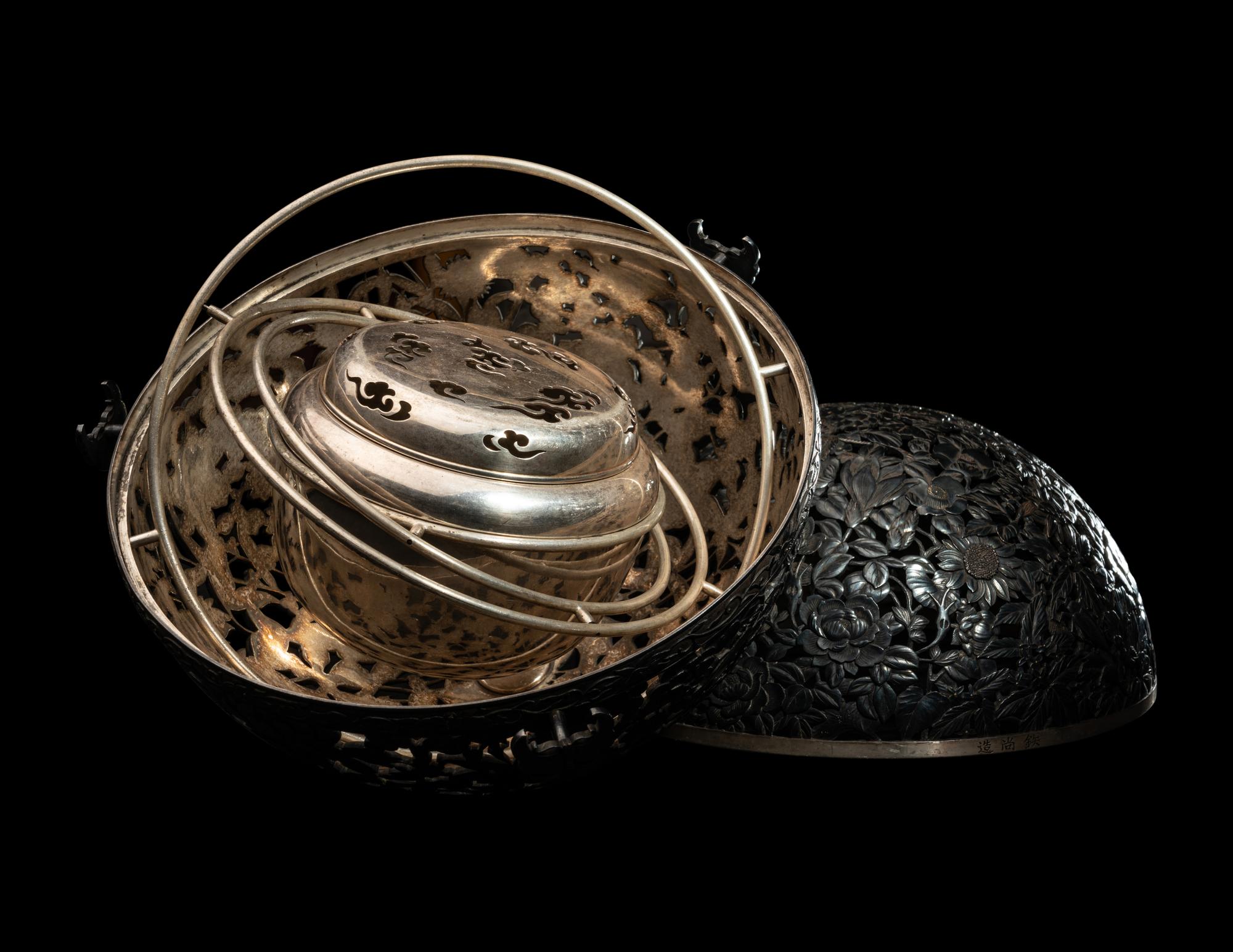 A Japanese Silver and Parcel Gilt Hanging Incense Ball