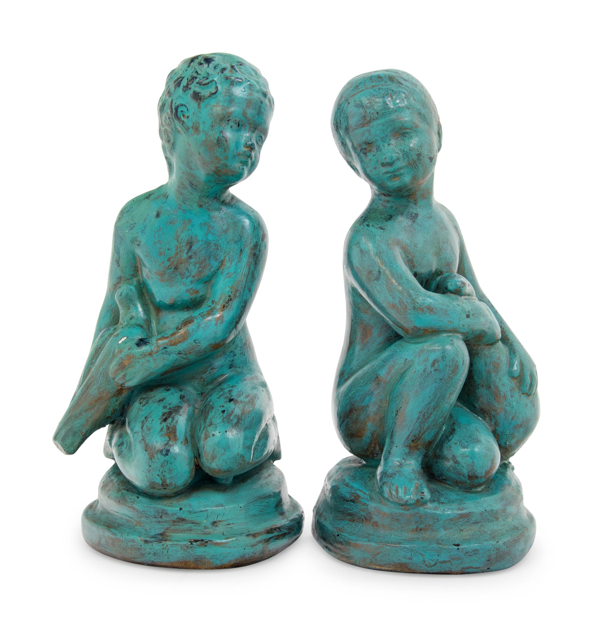 A Pair of Patinated Cast Metal Figures