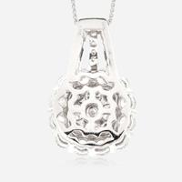 A diamond and fourteen karat white gold pendant