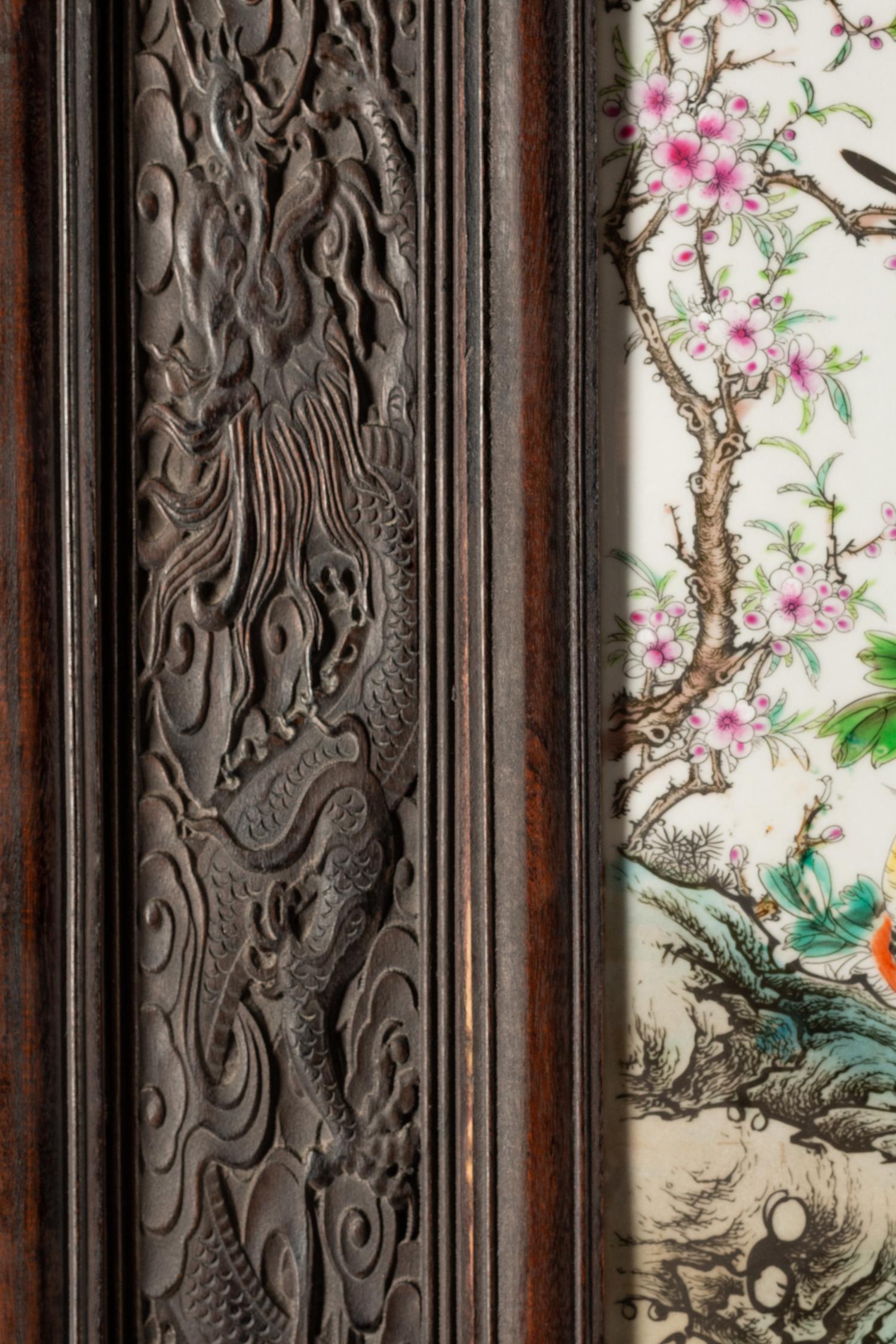 A Chinese Export Porcelain and Carved Hardwood Five-Panel Floor Screen