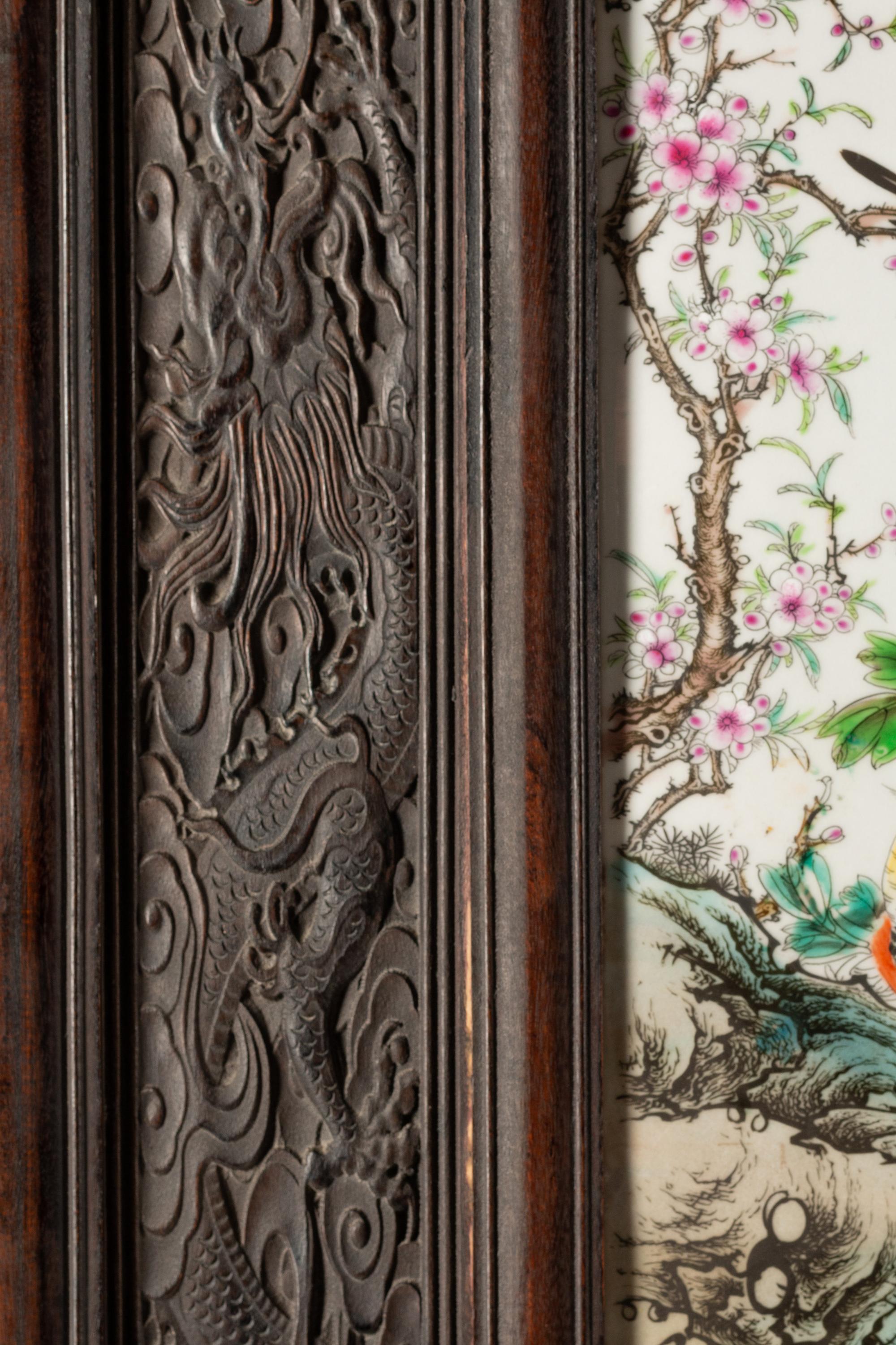 A Chinese Export Porcelain and Carved Hardwood Five-Panel Floor Screen