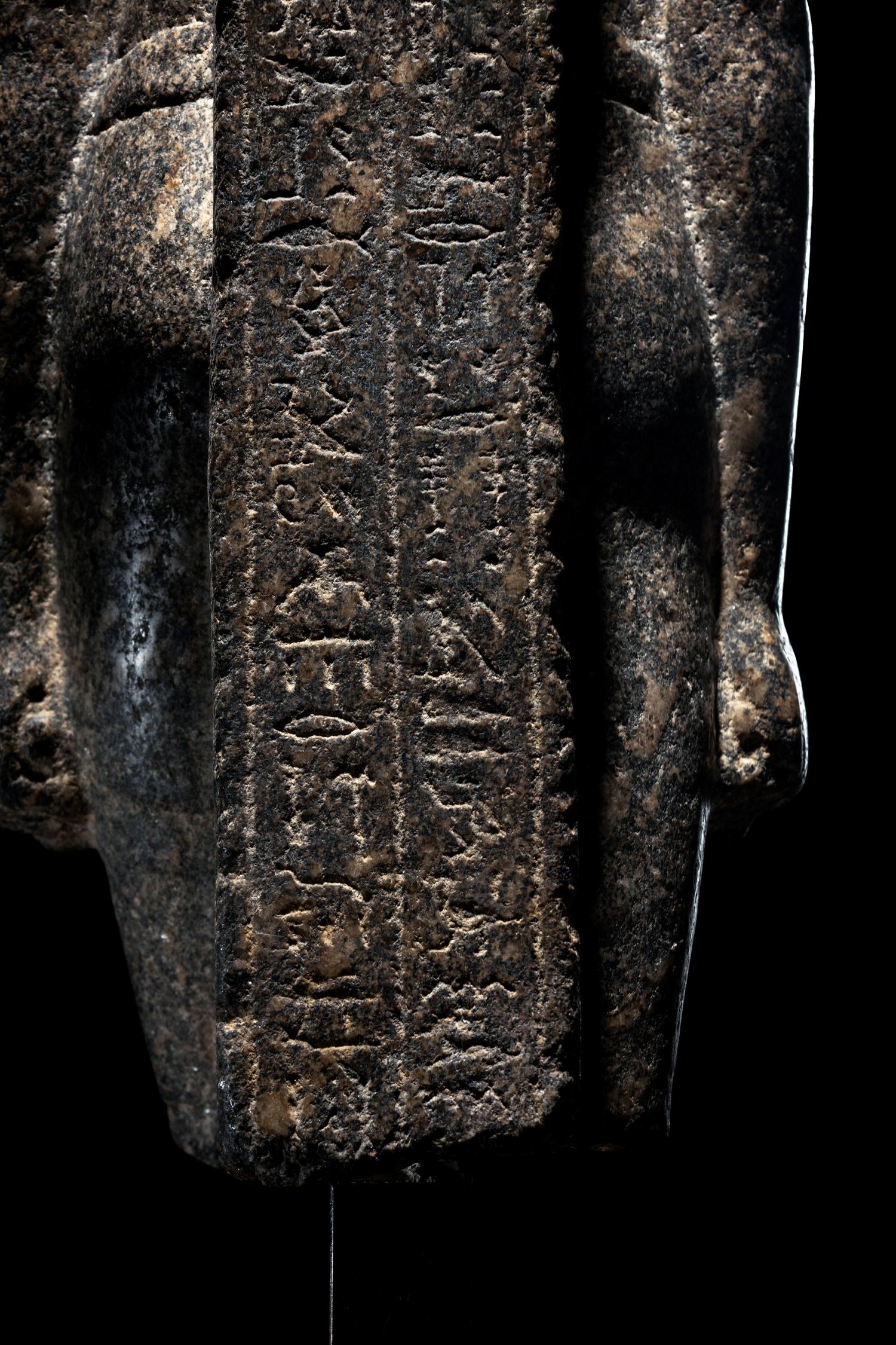 An Egyptian Granite Torso of an Official