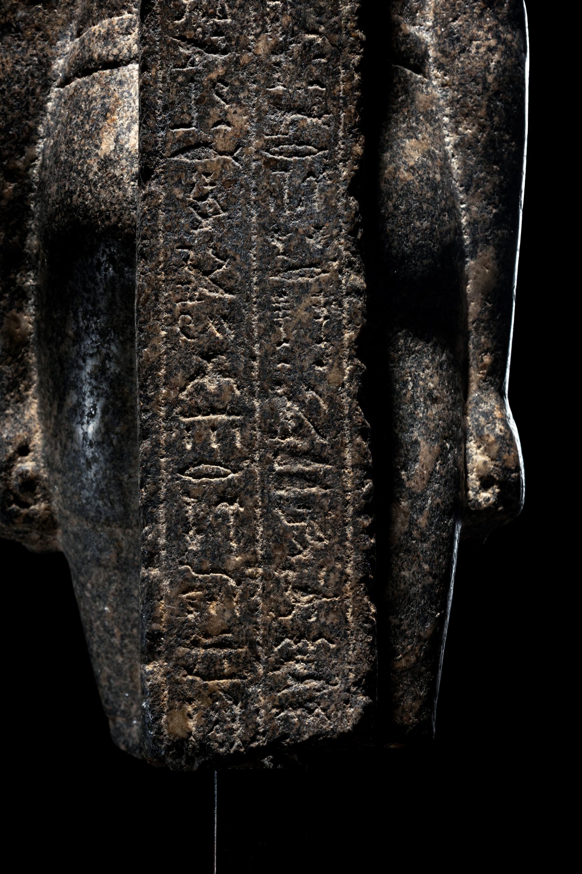 An Egyptian Granite Torso of an Official
