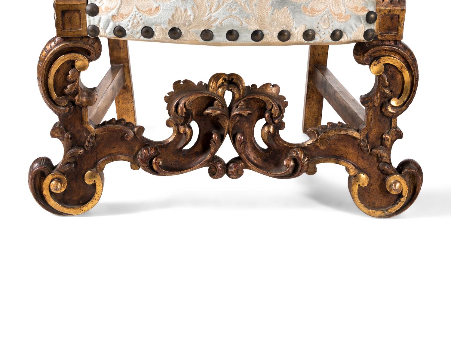 A Pair of Italian Baroque Style Parcel Gilt Walnut Armchairs