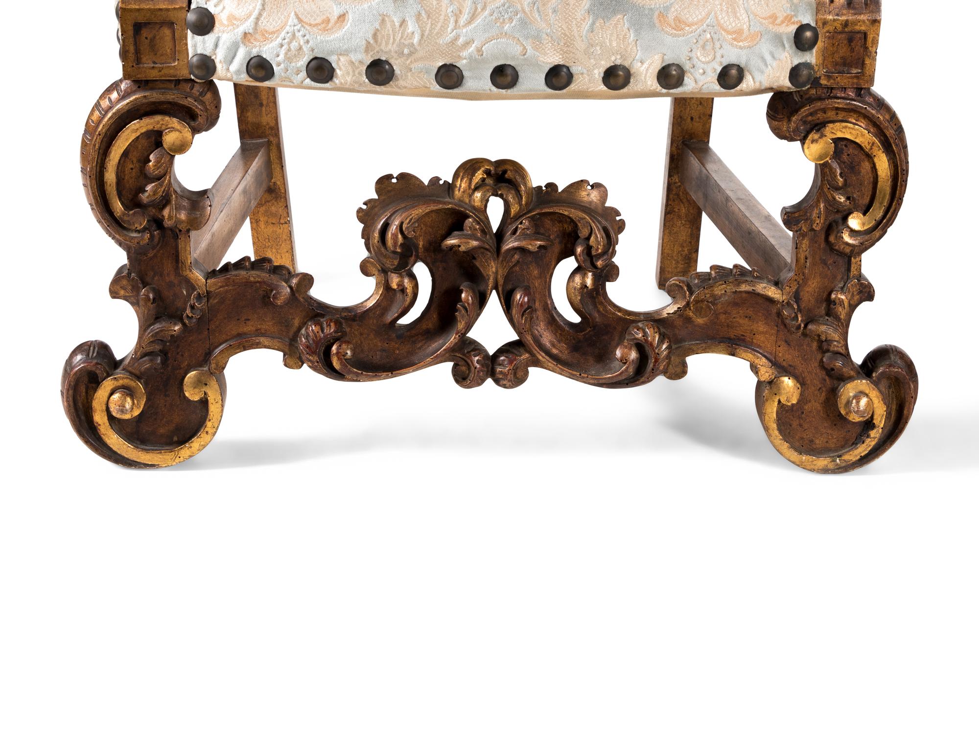 A Pair of Italian Baroque Style Parcel Gilt Walnut Armchairs