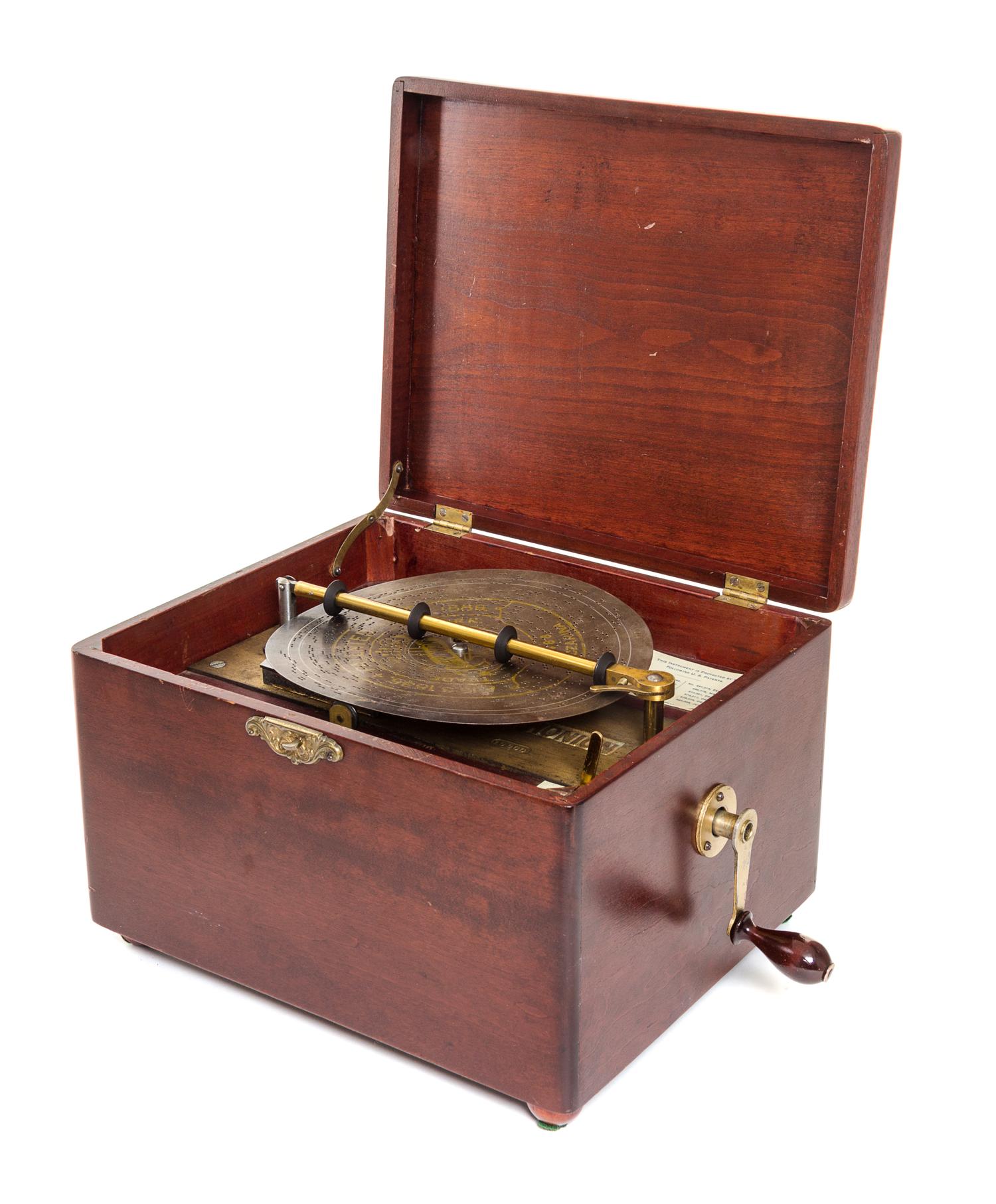 A Symphonium Disk Music Box Height 8 x width 11 5/8 x depth 9 3/4 inches. — LATE 19TH CENTURY