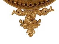 A George III Carved Giltwood Sea Dragon Bull's Eye Mirror
