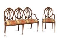 An Edwardian Painted Satinwood Triple-Back Settee and Armchair