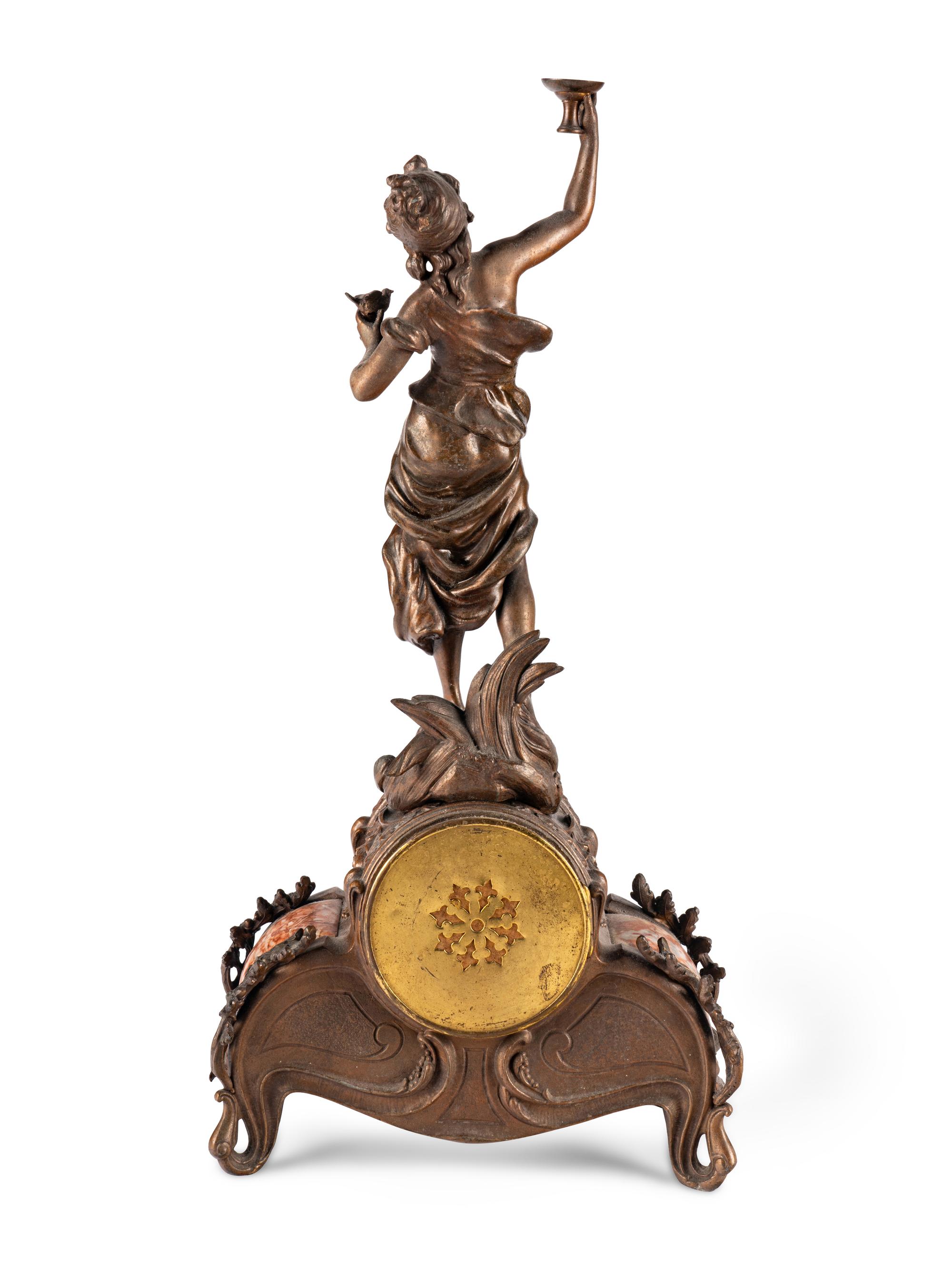 A French Cast Metal and Marble Figural Clock