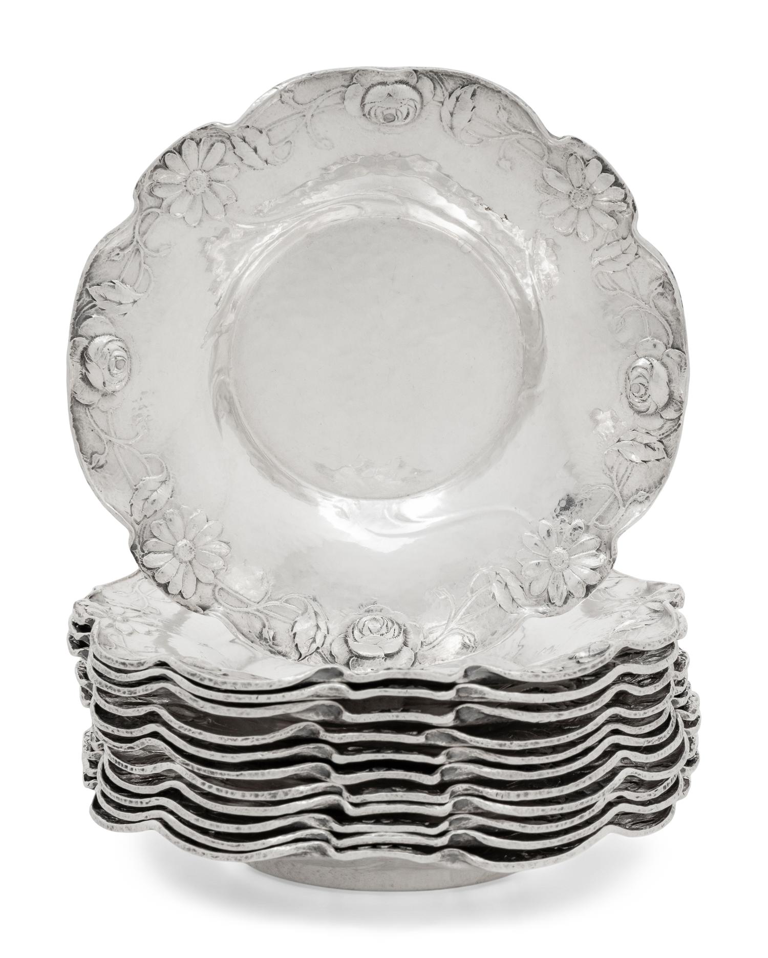 A Set of Twelve American Silver Martelé Coffee Cups and Saucers