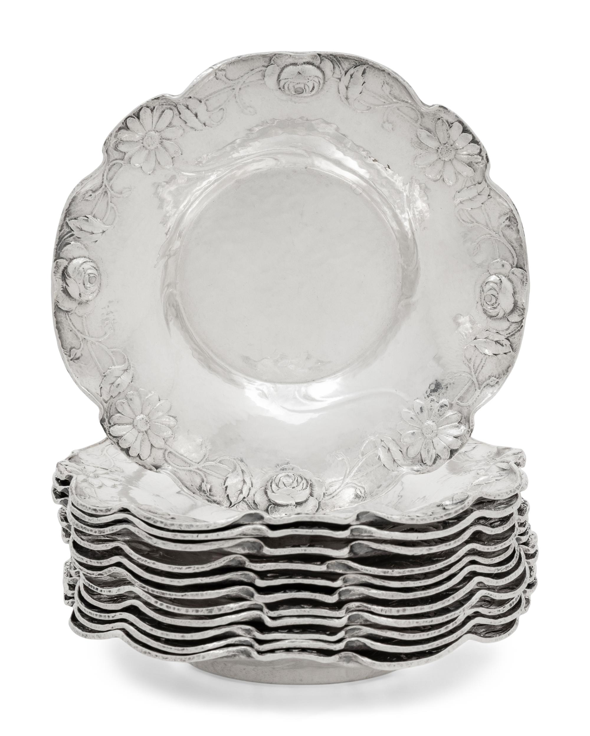 A Set of Twelve American Silver Martelé Coffee Cups and Saucers