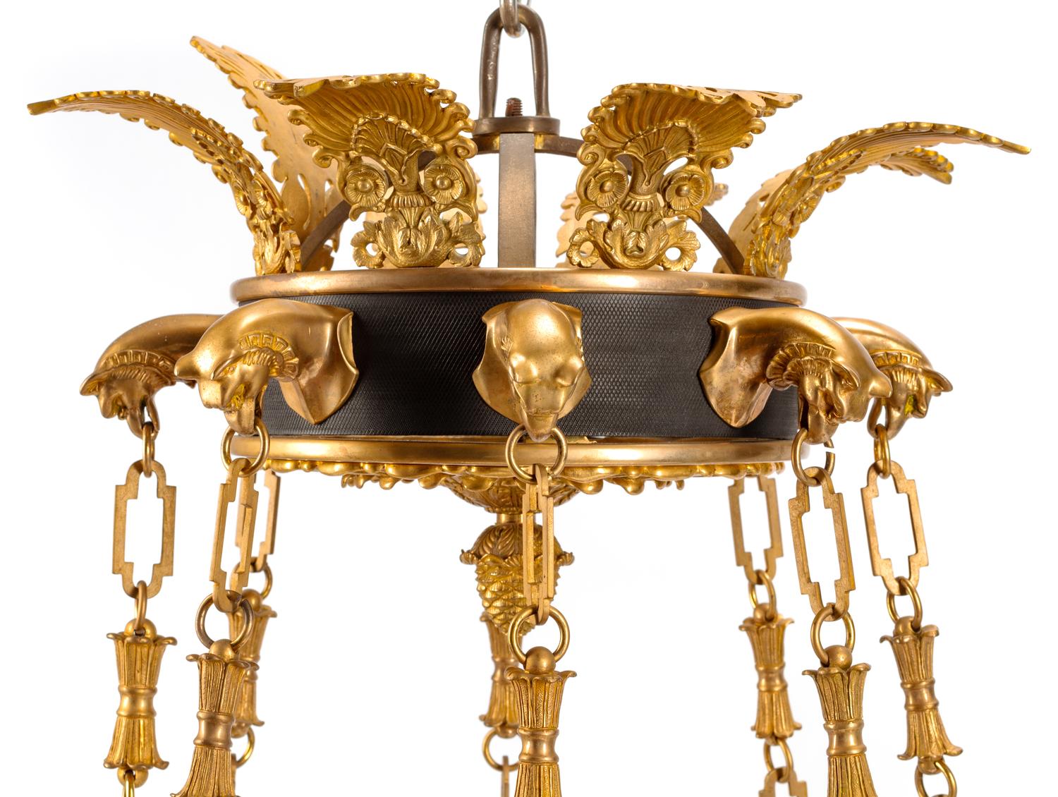 An Empire Style Gilt Bronze and Tôle Figural Chandelier