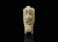 A Chinese carved celadon jade rhyton 玉爵杯