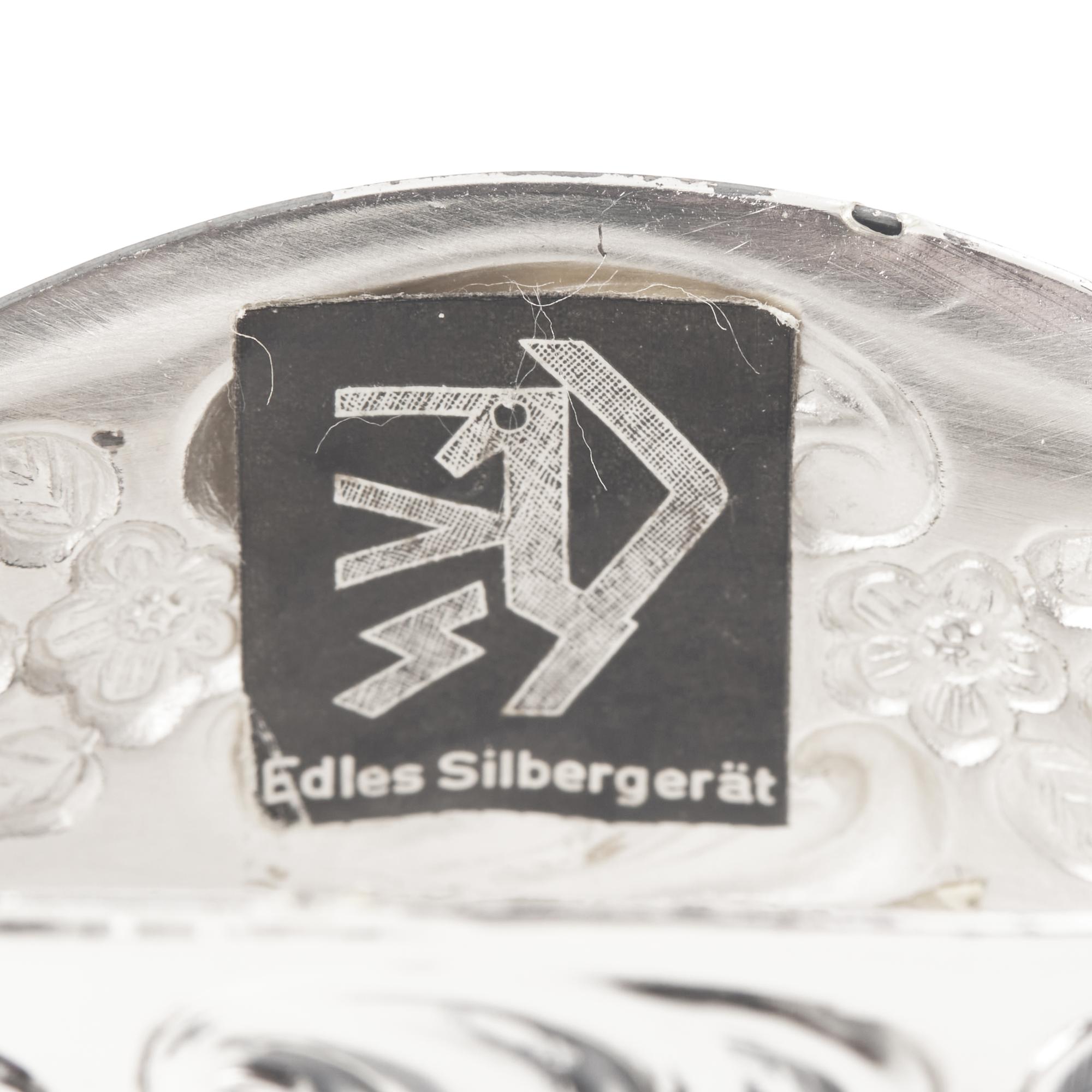 A Set of Twelve German Silver Napkin Rings