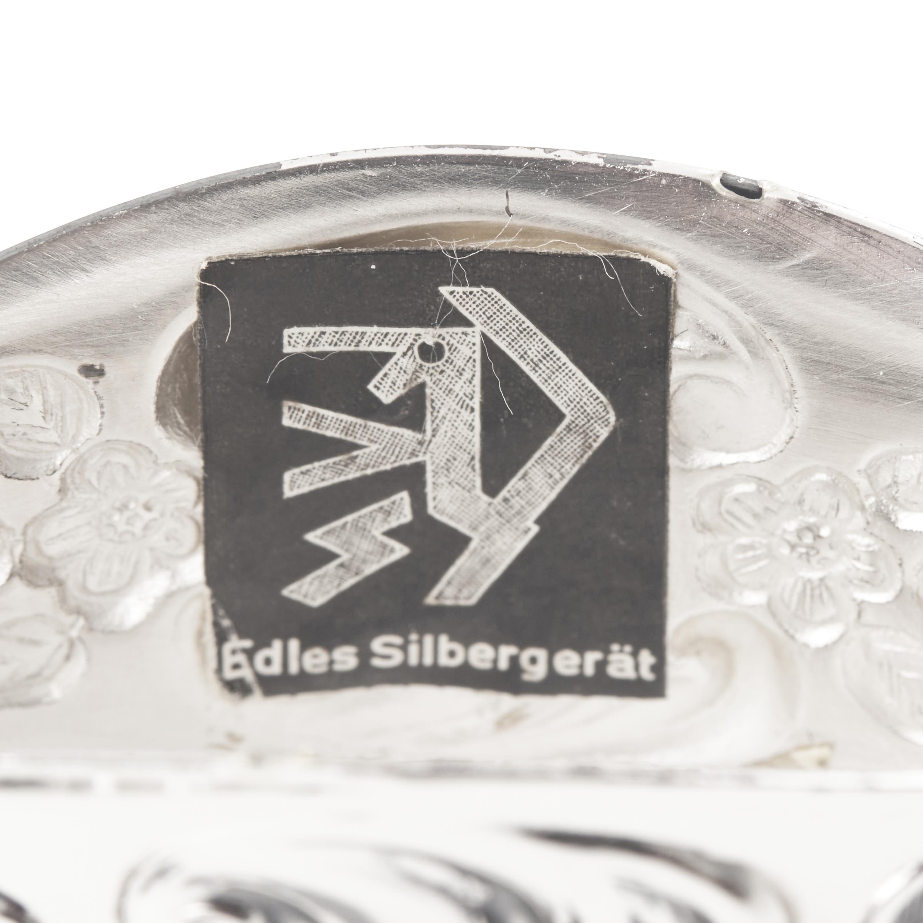 A Set of Twelve German Silver Napkin Rings