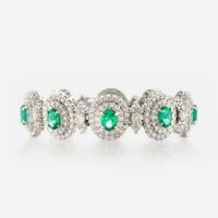 An emerald, diamond, and white gold bracelet