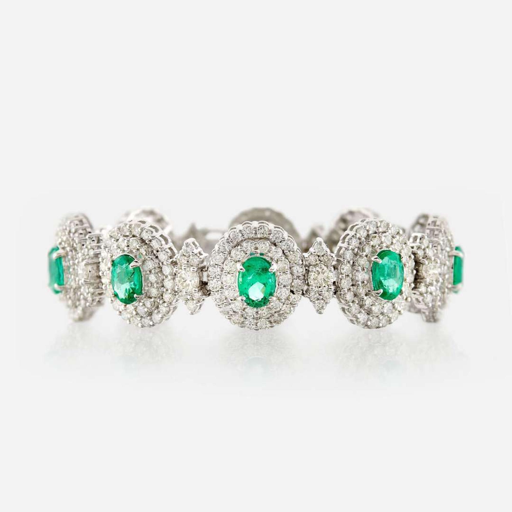 An emerald, diamond, and white gold bracelet