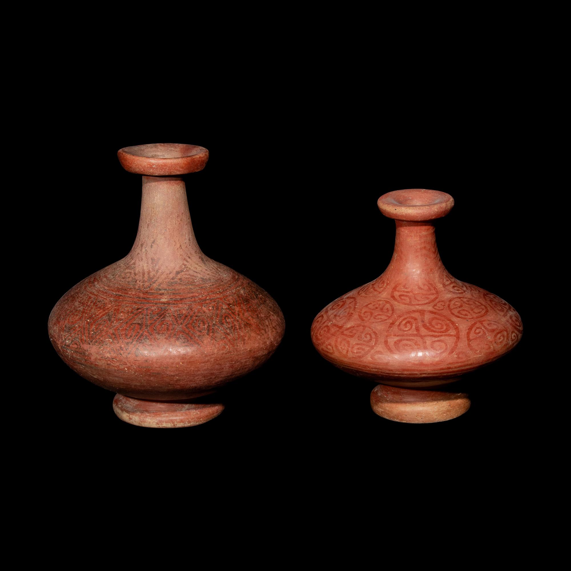 Two Capuli Polychrome Bottles