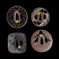 Group of four Japanese iron tsuba