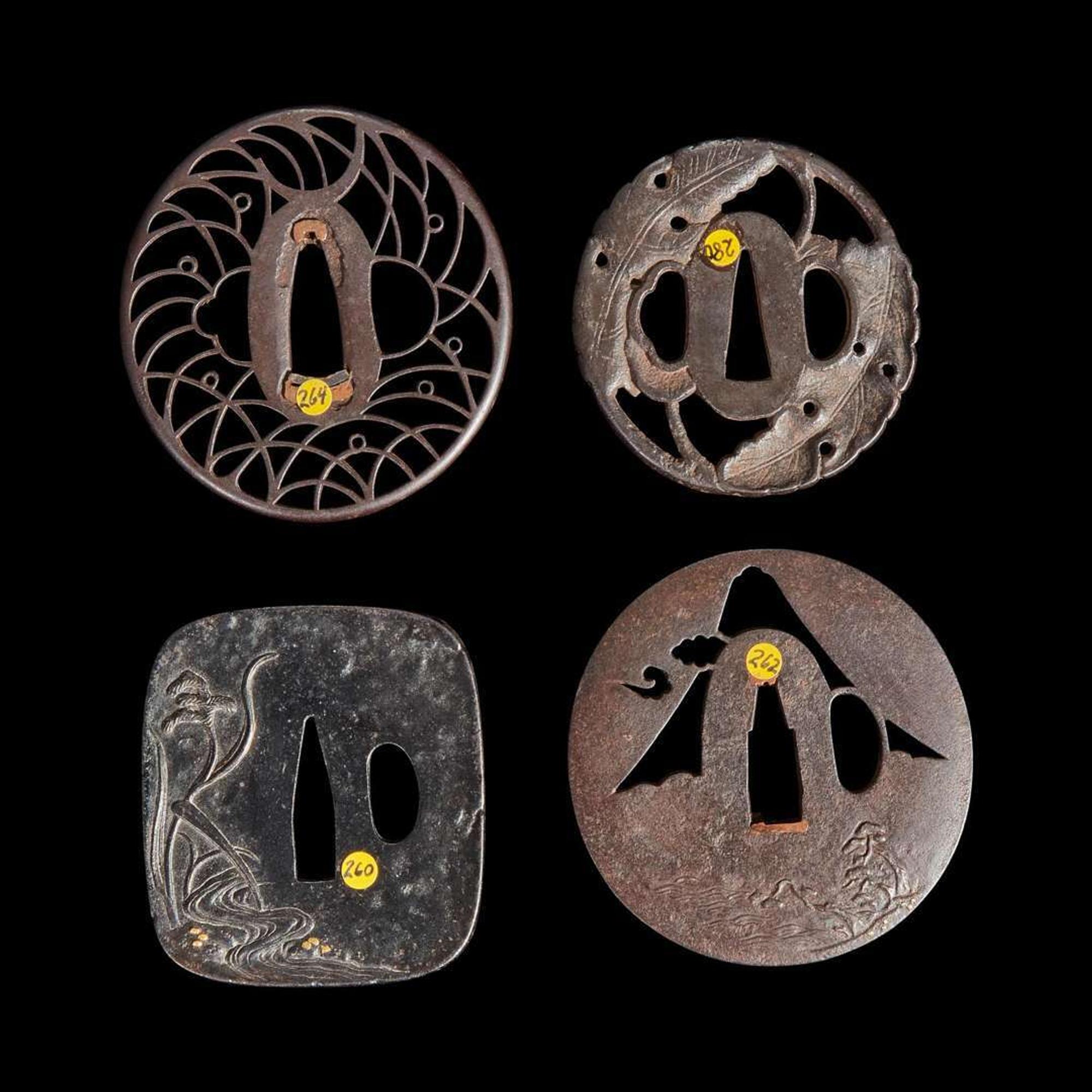 Group of four Japanese iron tsuba