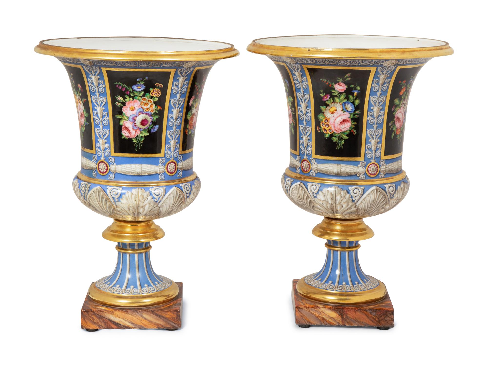 A Pair of Continental Parcel-Gilt and Polychrome Painted Porcelain Urns