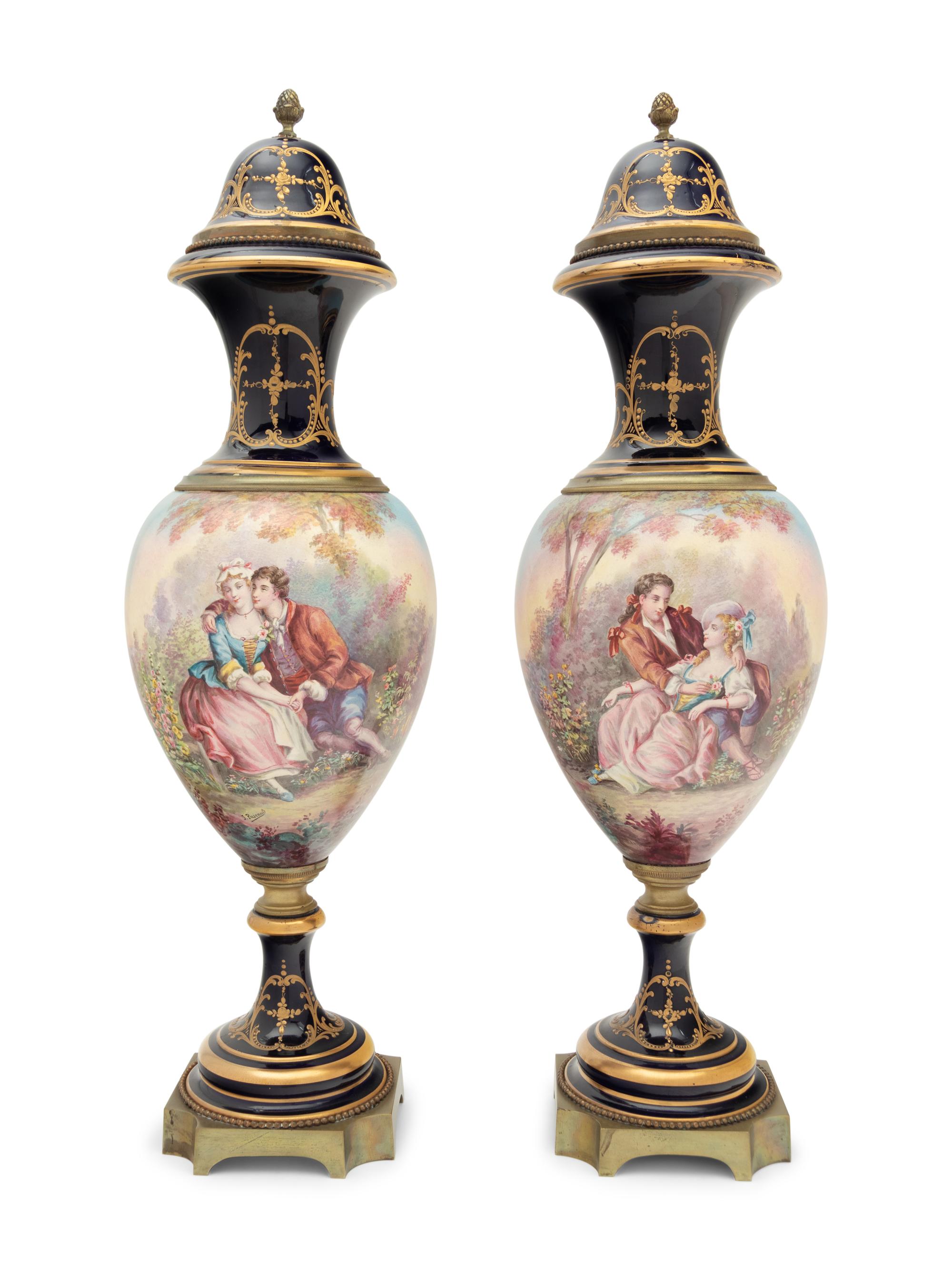 A Pair of Sèvres Style Gilt Bronze Mounted Porcelain Urns