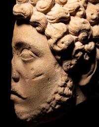 A Roman Marble Portrait Head of Marcus Aurelius from a Relief