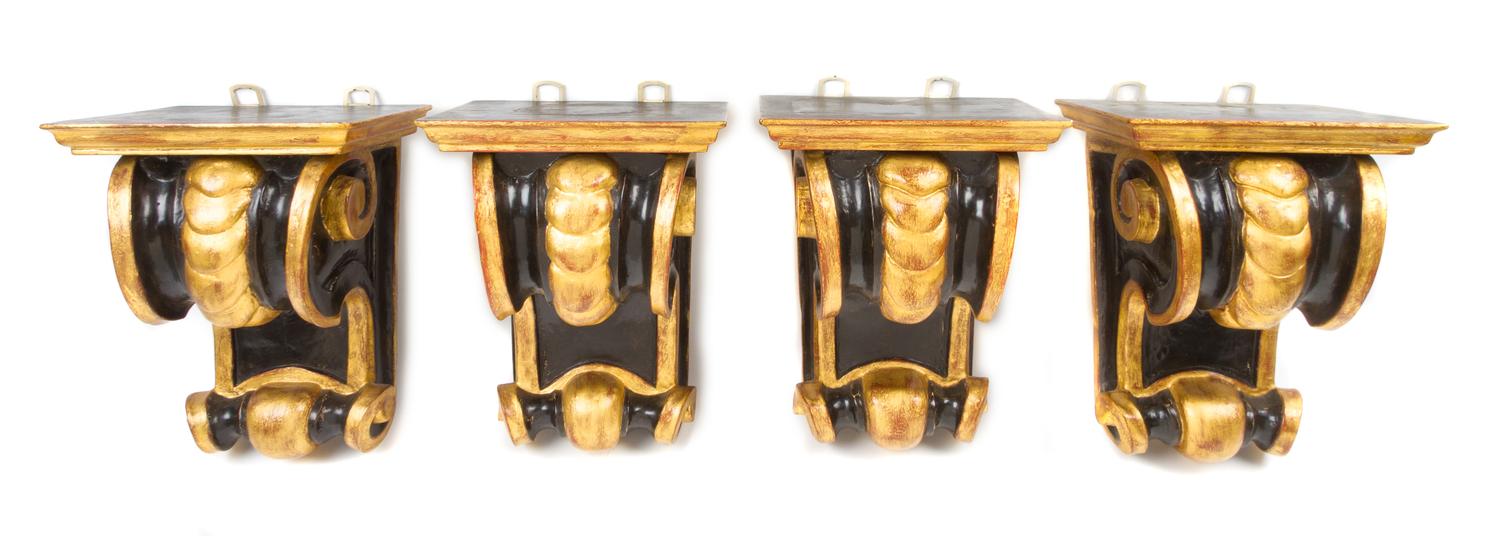 Four Continental Ebonized and Parcel Gilt Wall Brackets, Height 10 3/4 inches.