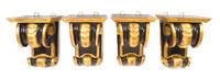 Four Continental Ebonized and Parcel Gilt Wall Brackets, Height 10 3/4 inches.