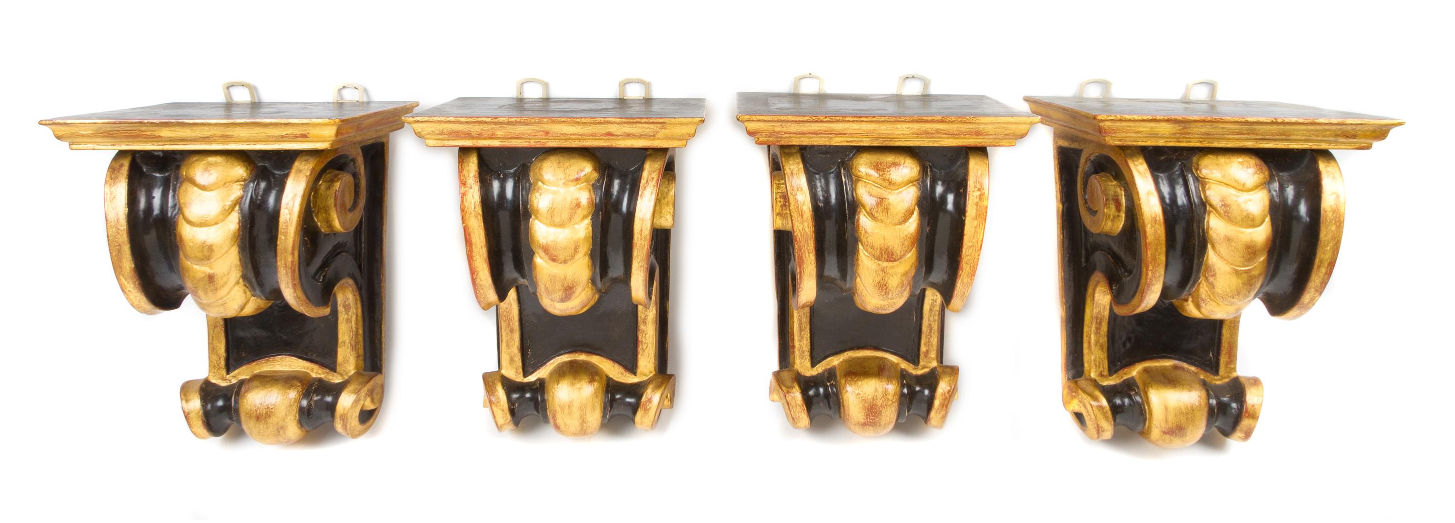 Four Continental Ebonized and Parcel Gilt Wall Brackets, Height 10 3/4 inches.
