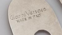 A Gianni Versace Geometric Lapel Pin, 4" x 3".