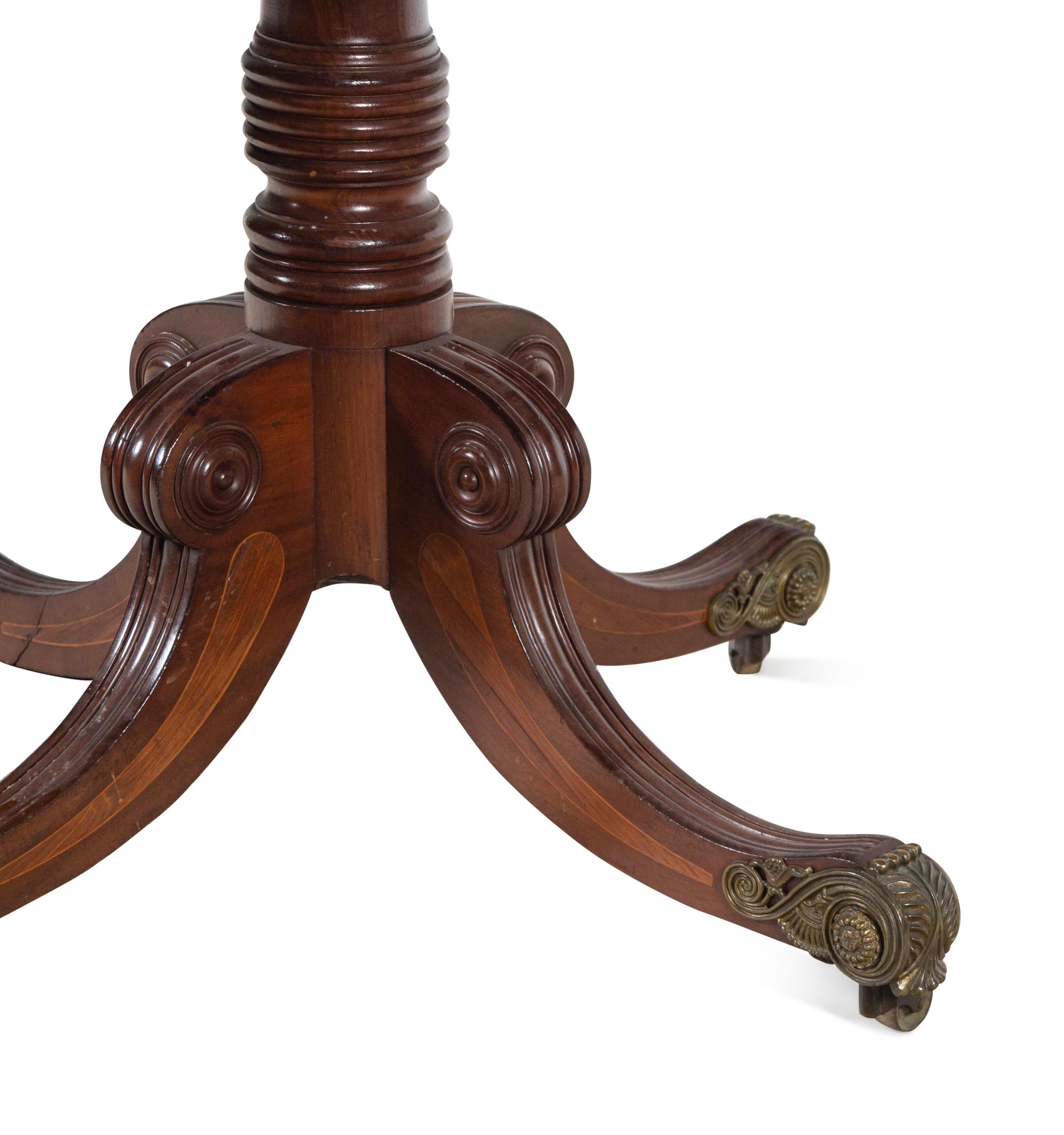 A Regency Gilt Bronze Mounted Mahogany and Rosewood Breakfast Table