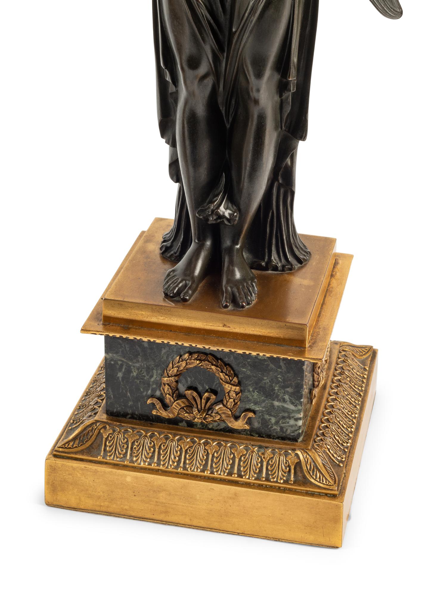 A Pair of Empire Style Gilt and Patinated Bronze and Marble Figural Candelabra
