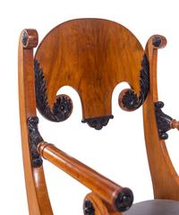 A Pair of Biedermeier Parcel Ebonized Armchairs