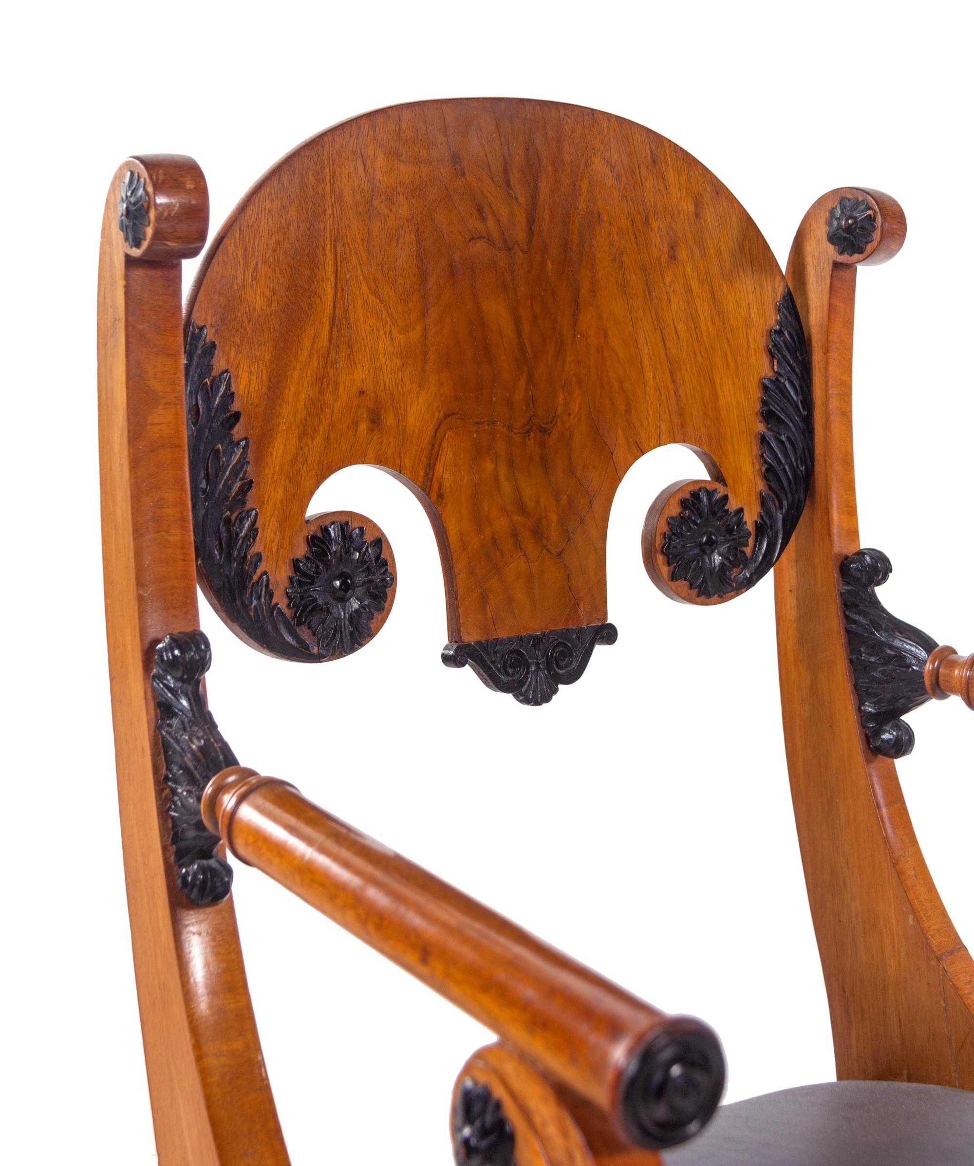 A Pair of Biedermeier Parcel Ebonized Armchairs