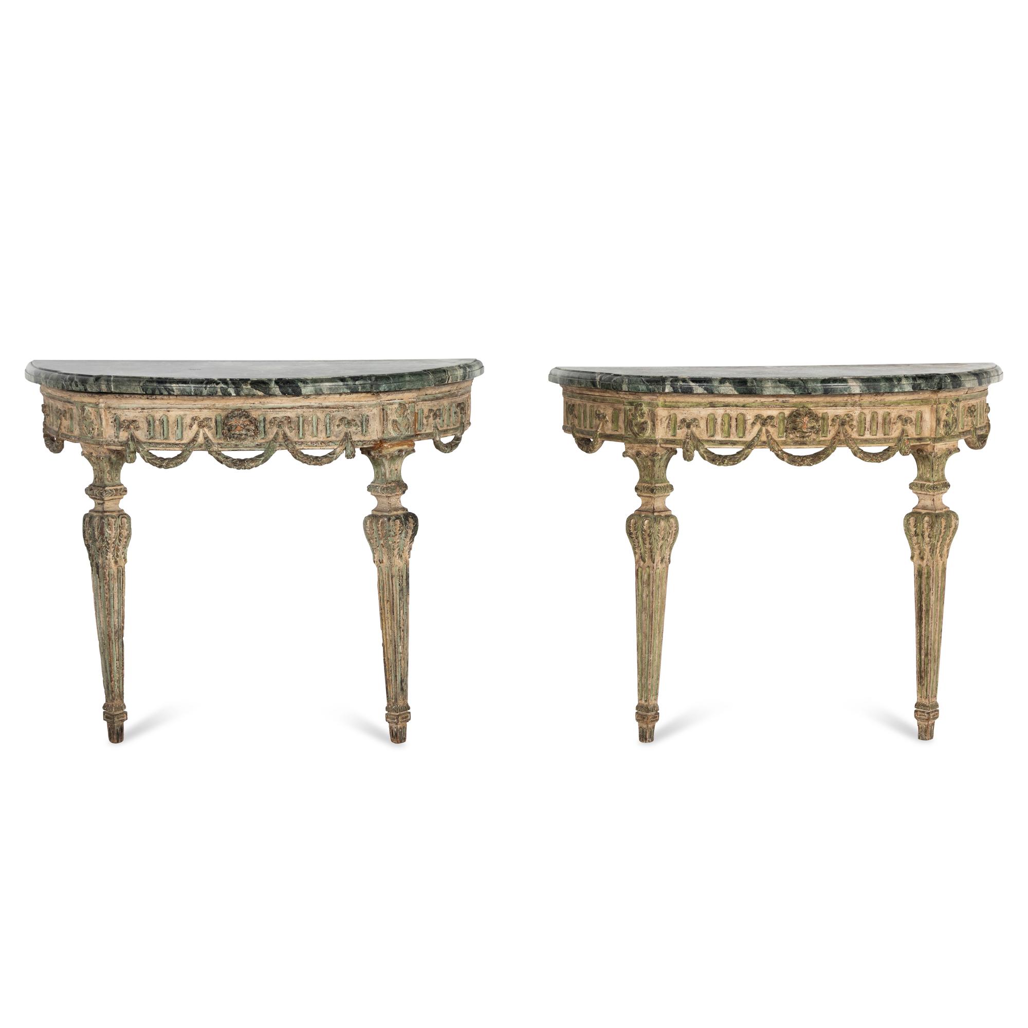 A Pair of Italian Neoclassical White and Green Painted Faux Marble-Top Demilune Console Tables
