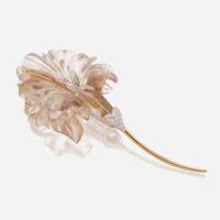 A rutilated quartz, diamond, and eighteen karat gold brooch