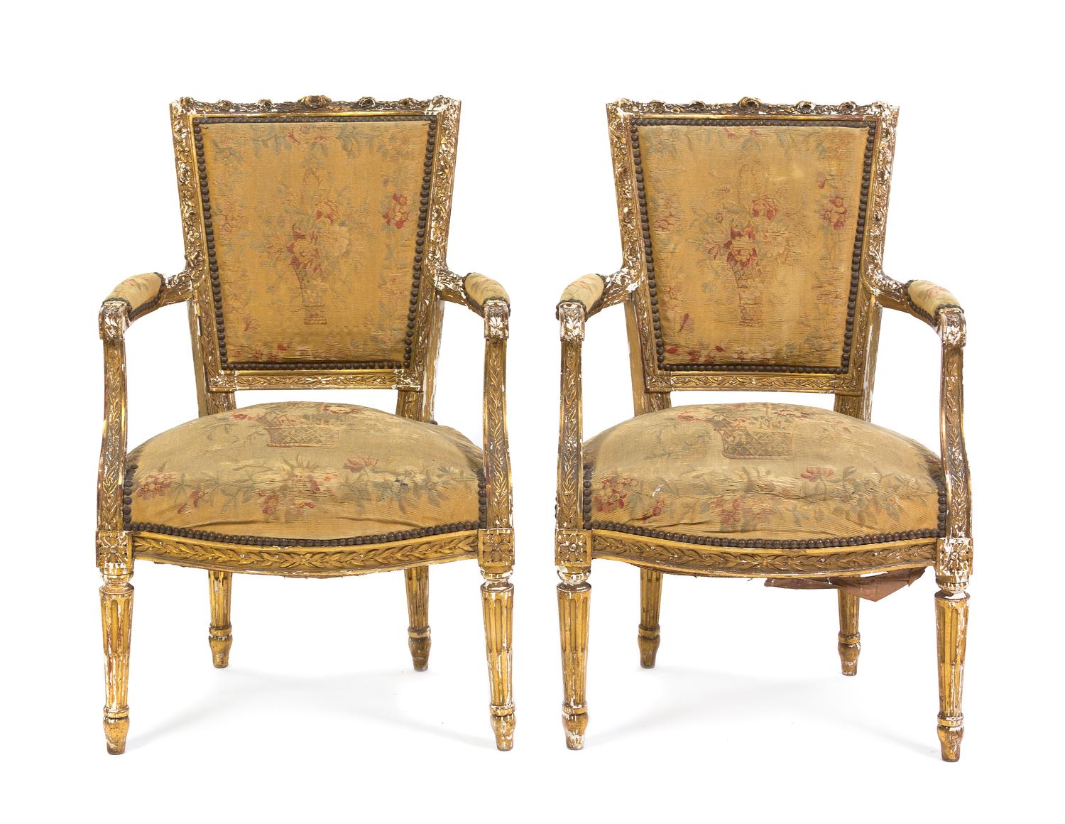 A Pair of Louis XVI Giltwood Fauteuils, Height 33 1/4 inches.