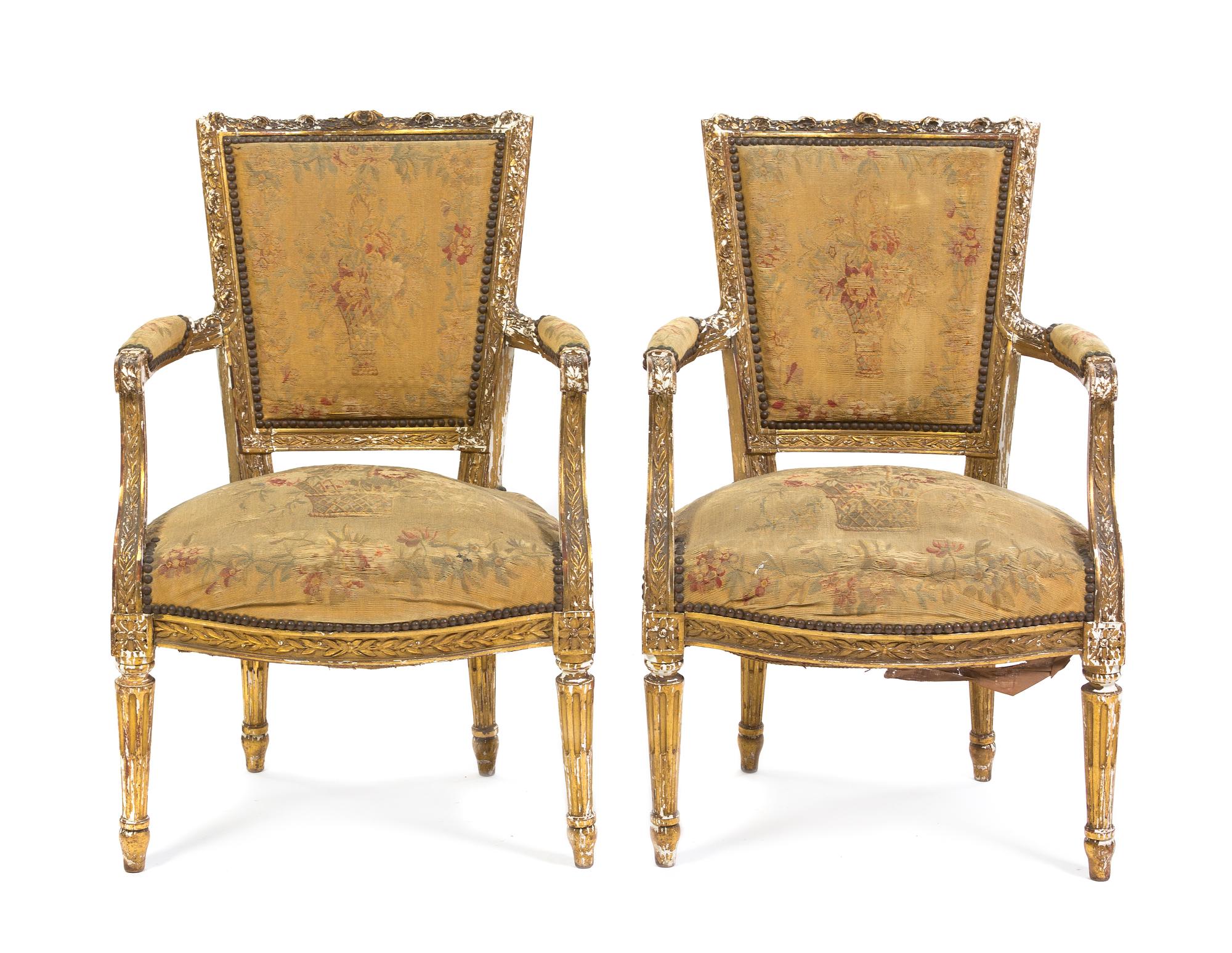 A Pair of Louis XVI Giltwood Fauteuils, Height 33 1/4 inches.