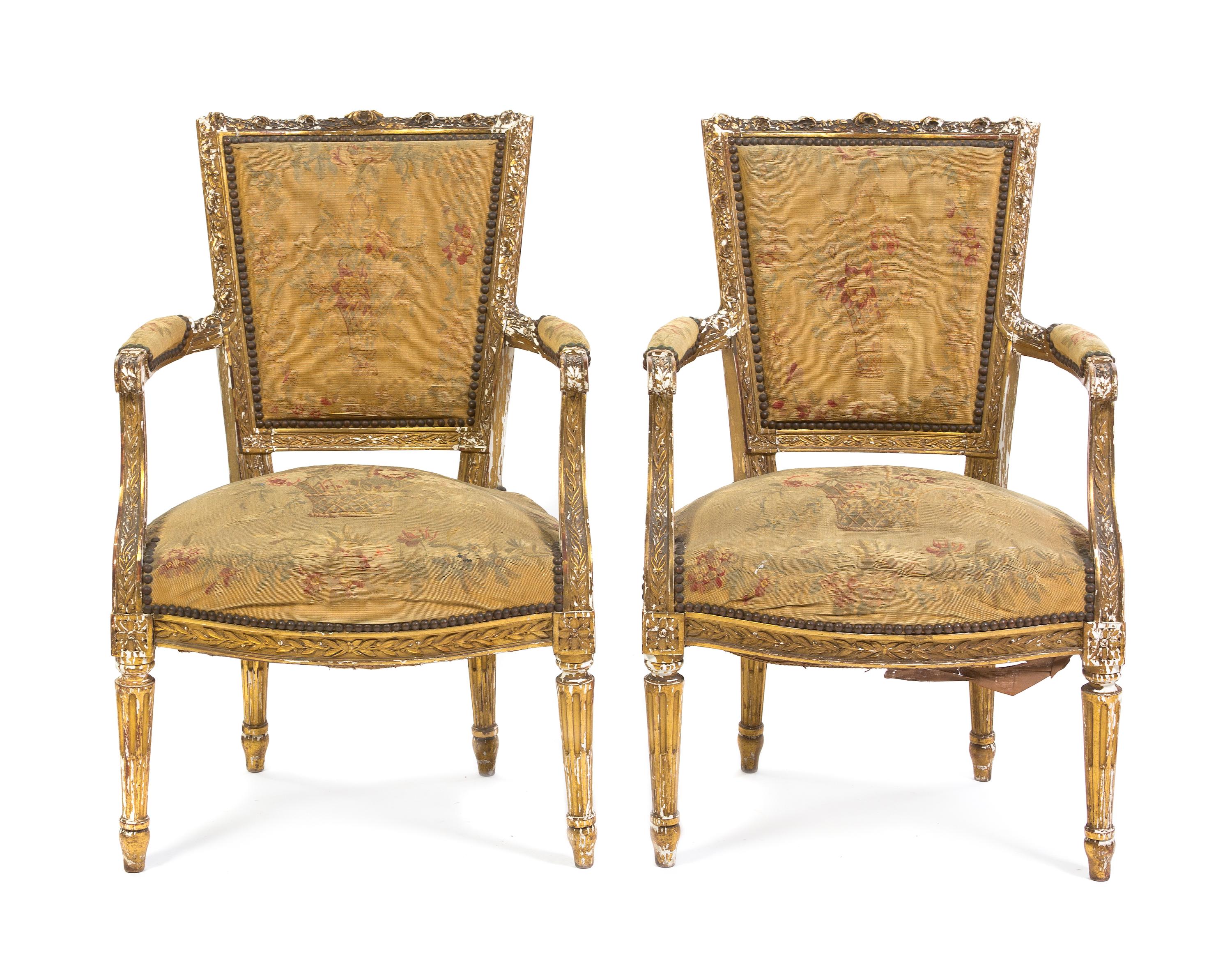 A Pair of Louis XVI Giltwood Fauteuils, Height 33 1/4 inches.