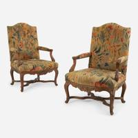 A Pair of French Régence Carved Walnut Bergères 18th century