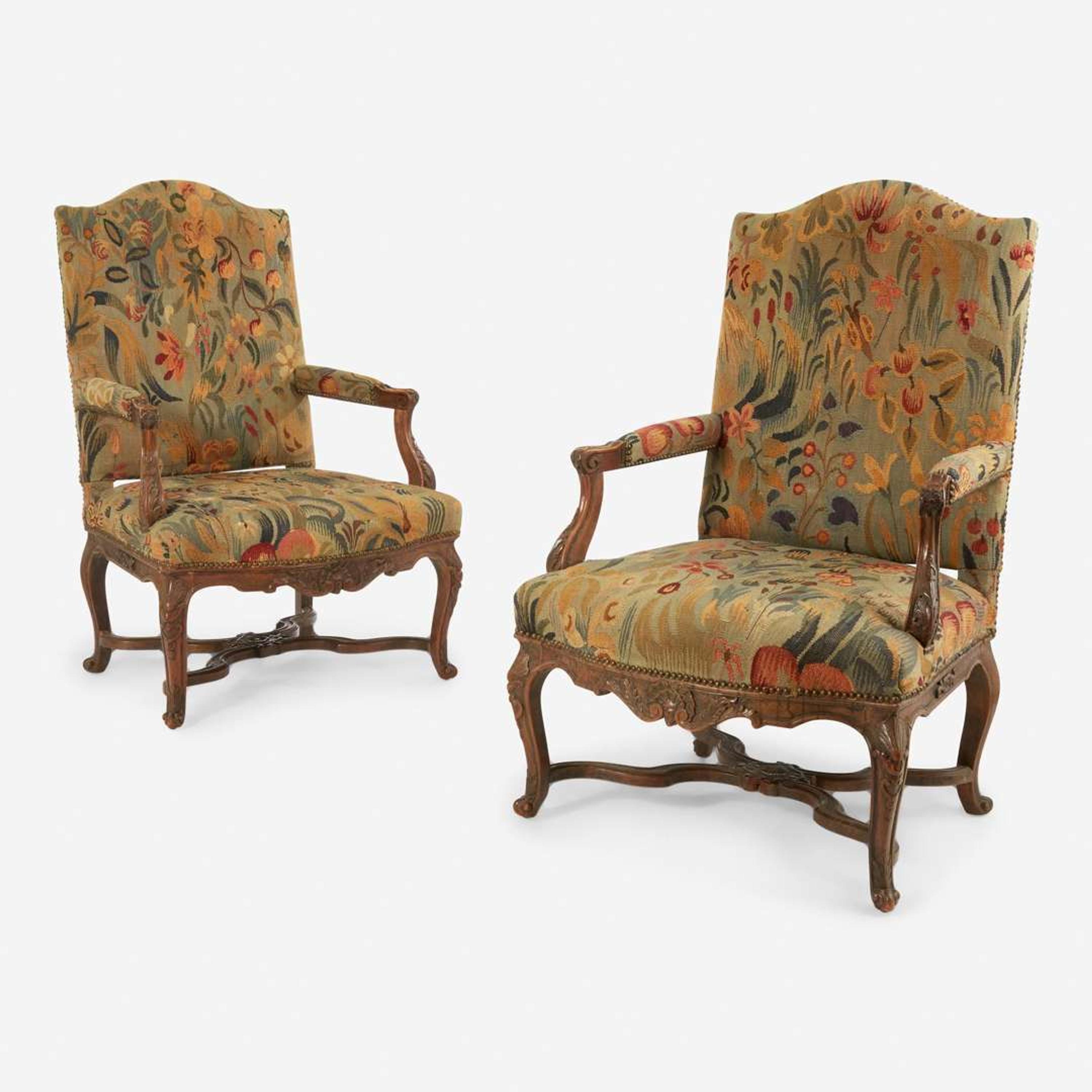 A Pair of French Régence Carved Walnut Bergères 18th century