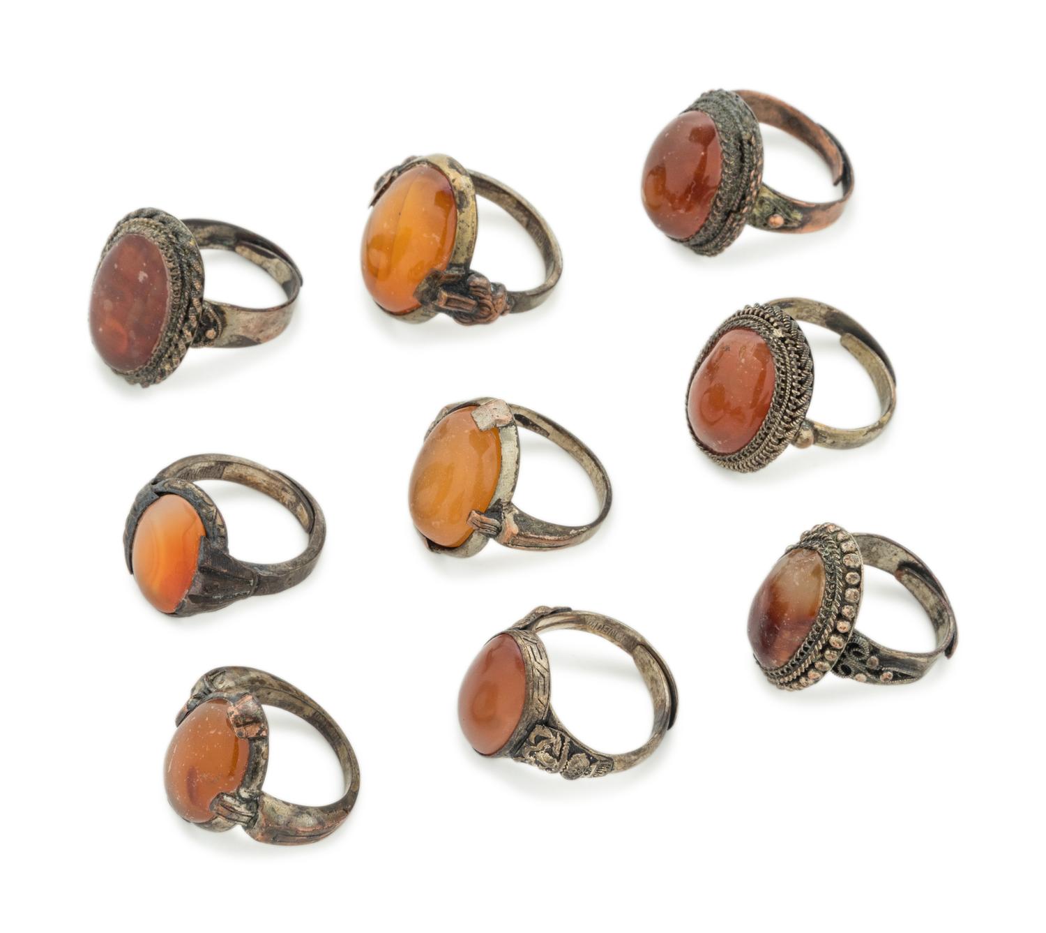 Nine Chinese Carnelian Agate Inset Metal Rings