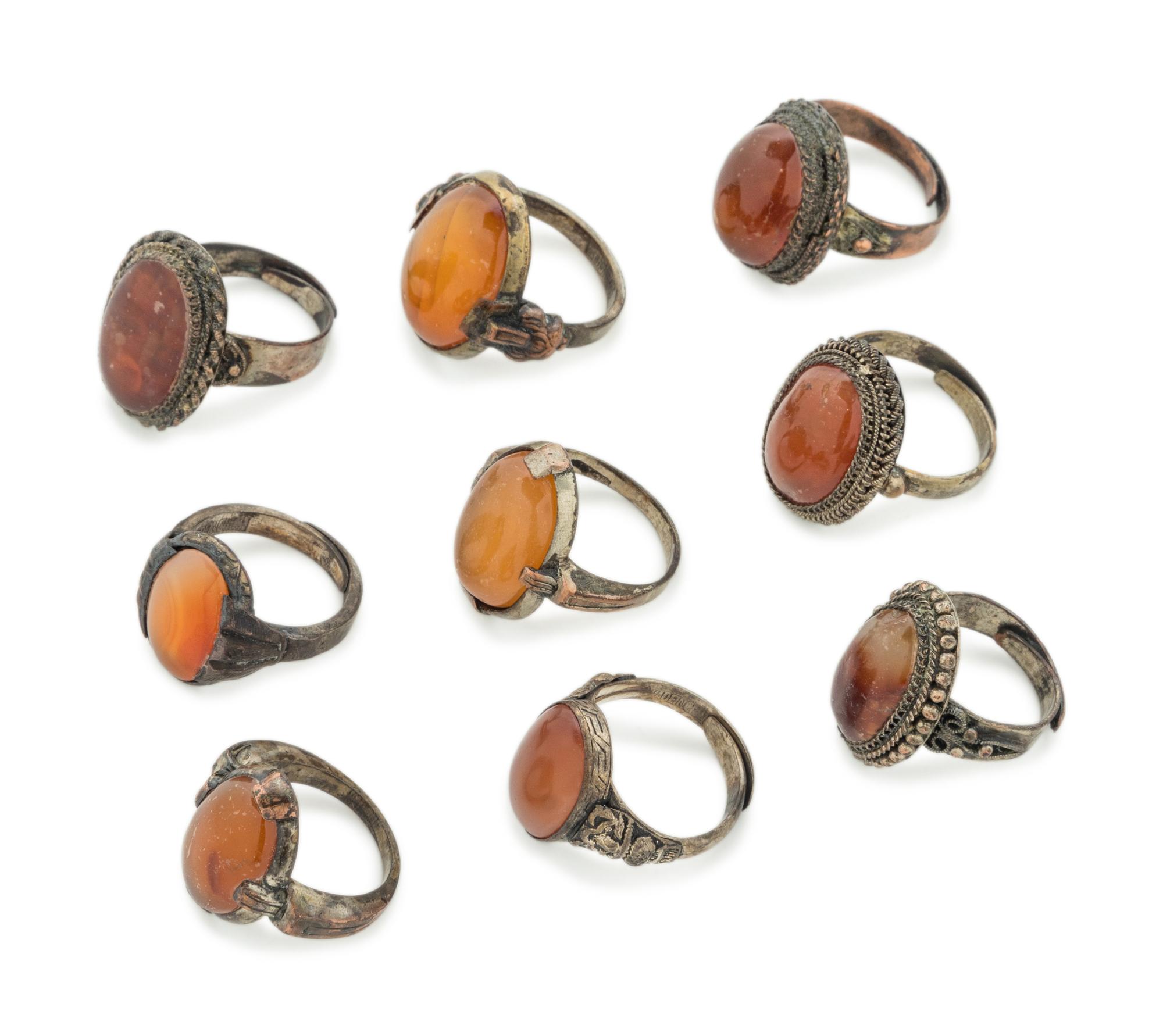 Nine Chinese Carnelian Agate Inset Metal Rings